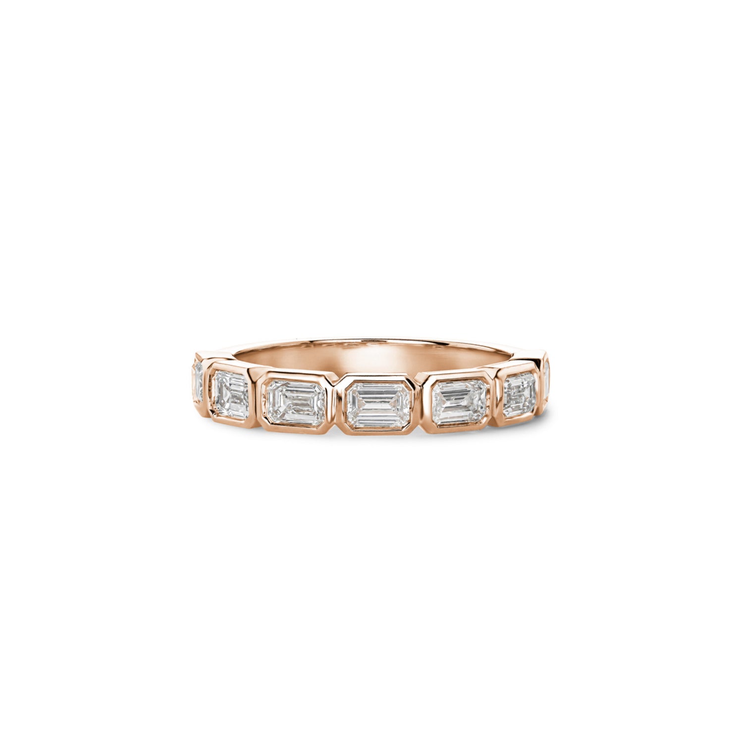 Emerald-cut lab-grown diamonds in rose gold bezel settings across a half-eternity ring.