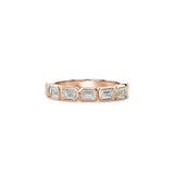 Emerald-cut lab-grown diamonds in rose gold bezel settings across a half-eternity ring.