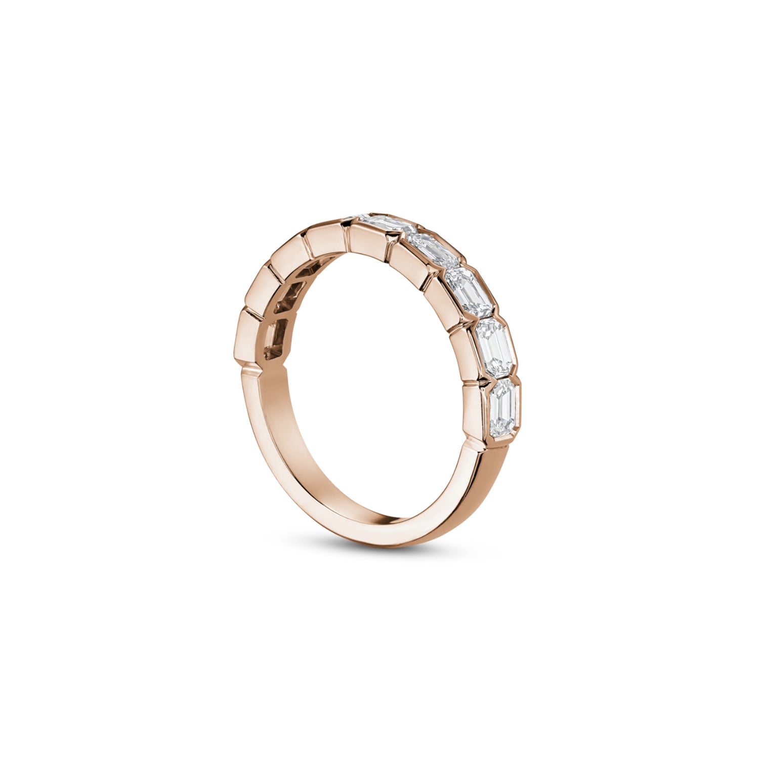 Side profile of an emerald-cut lab-grown diamond half-bezel half-eternity ring in rose gold, showing the settings and polished band.