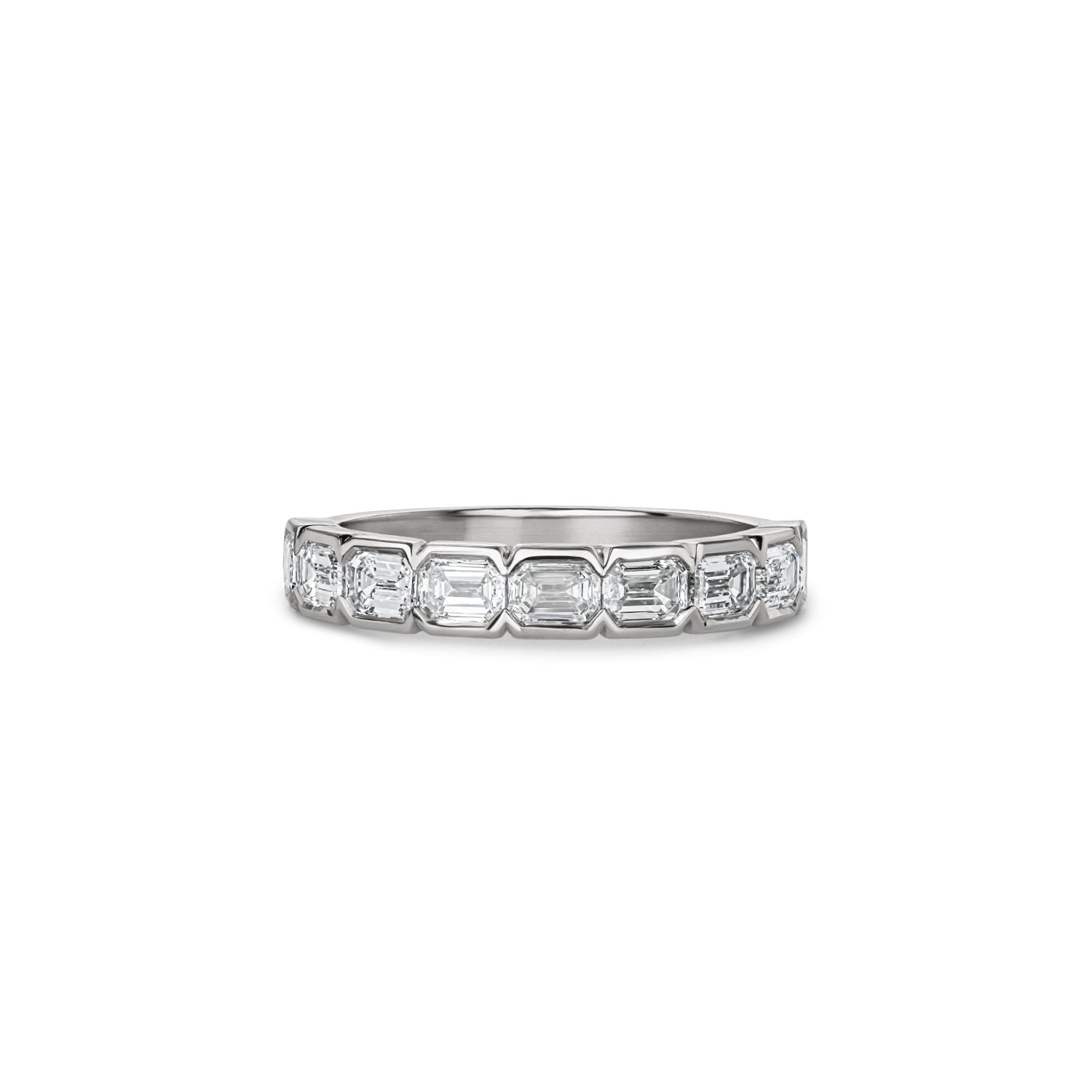 Emerald-cut lab-grown diamond half-eternity ring with half-bezel settings in white gold.