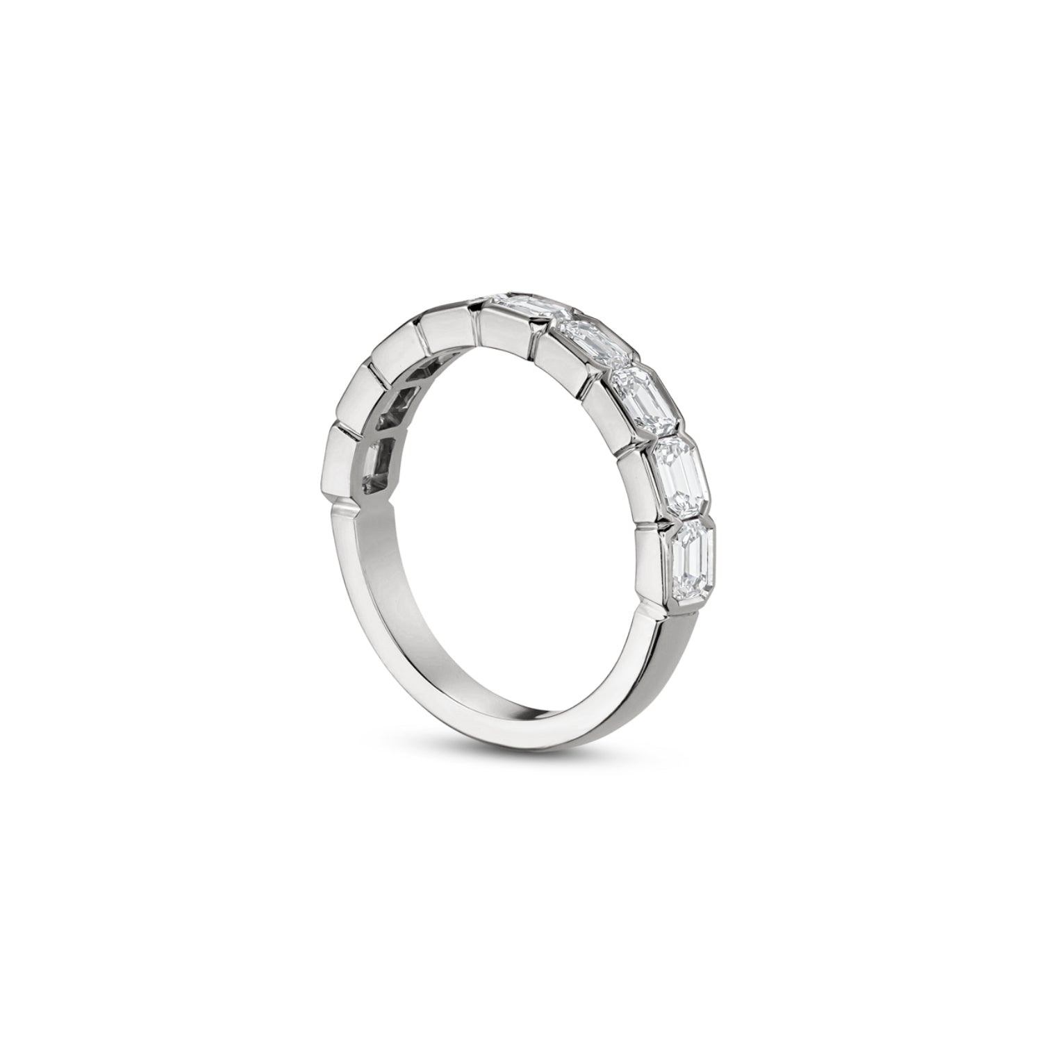 Side profile of an emerald-cut lab-grown diamond half-bezel half-eternity ring in white gold, showing the settings and polished band.