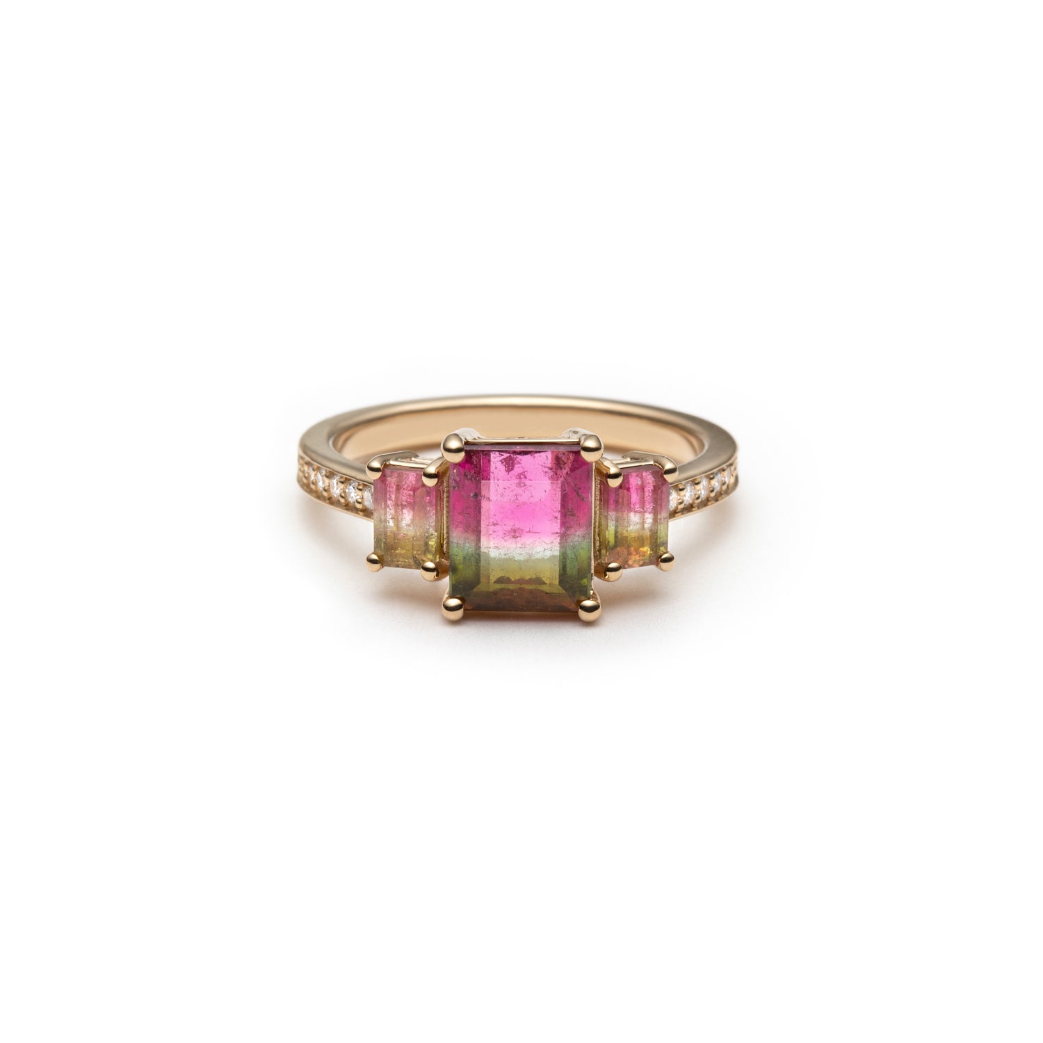 Emerald-cut watermelon tourmaline three-stone ring with a diamond pavé band.