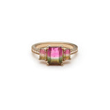 Emerald-cut watermelon tourmaline three-stone ring with a diamond pavé band.