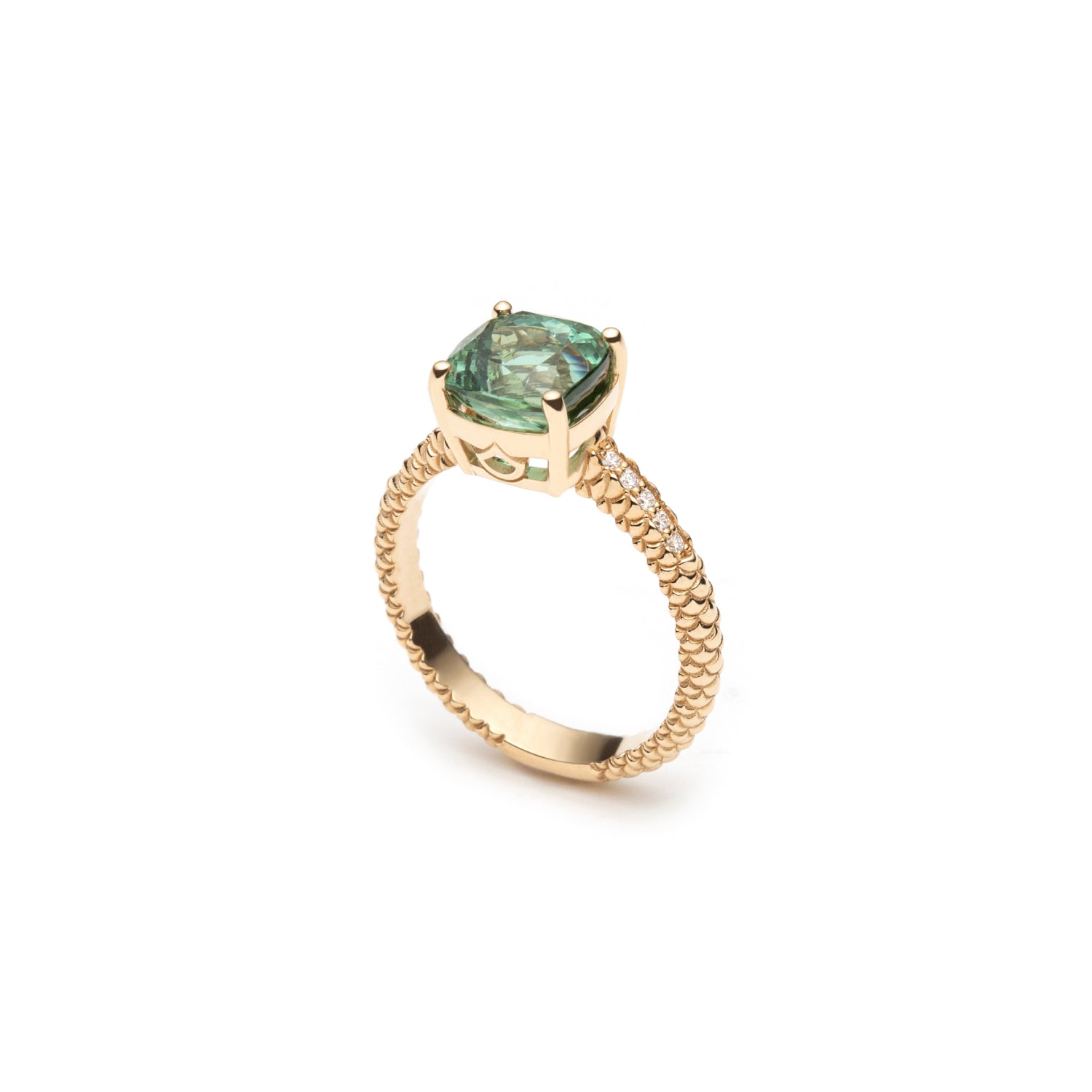 Side view of the Lepia green tourmaline ring, showing the gemstone setting and textured 14K yellow gold band.