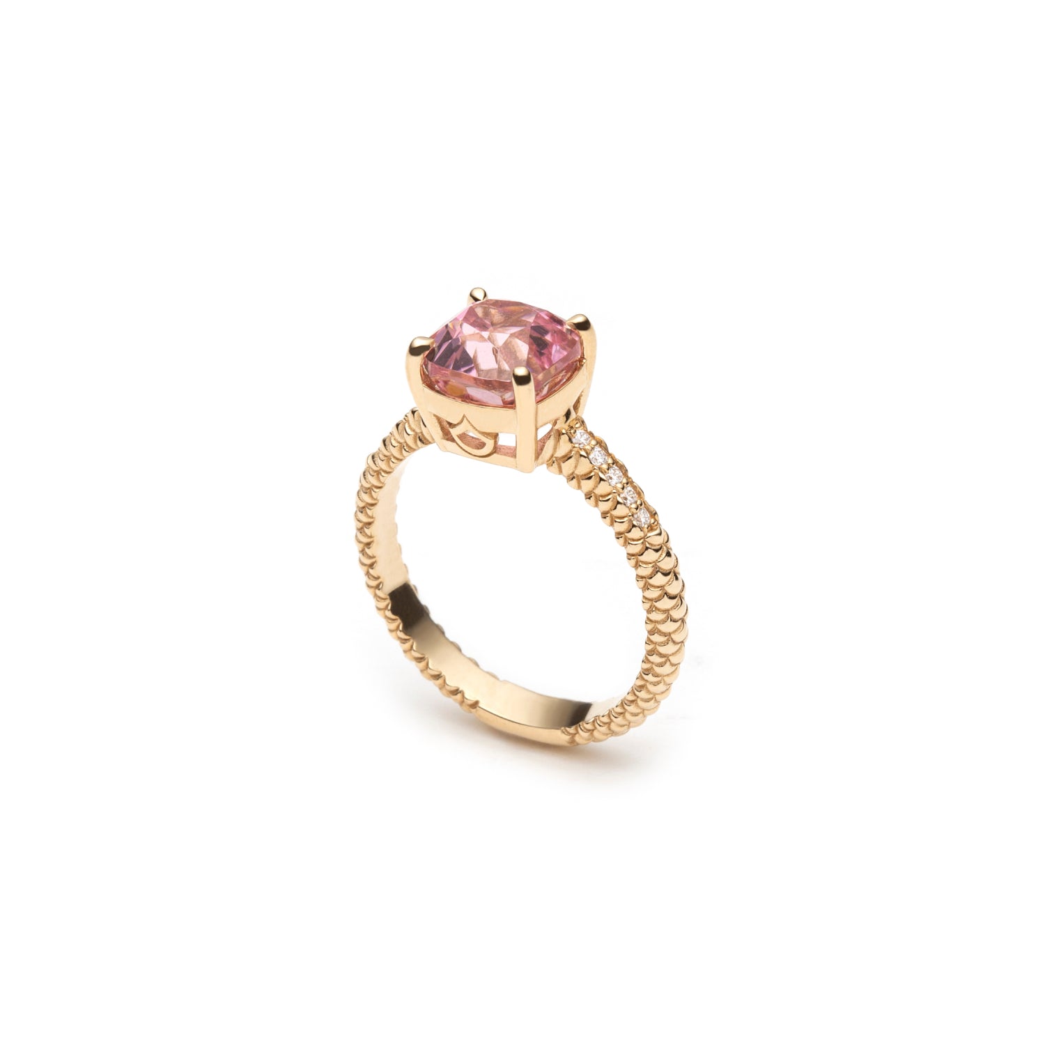 Side view of the Lepia pink tourmaline ring, showing the gemstone setting and textured 14K yellow gold band.