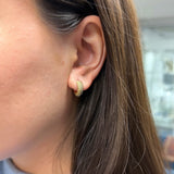 Lepia mermaid scales motif chunky huggie earrings in yellow gold on ear