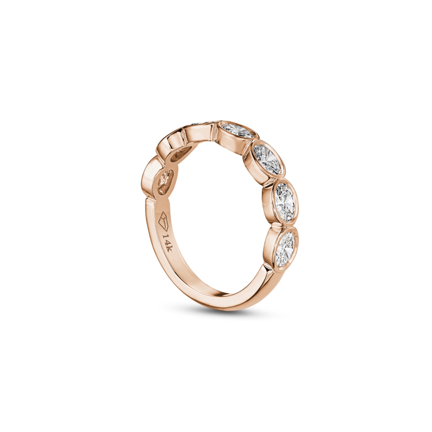 Side profile of an oval-shaped lab-grown diamond bezel half-eternity ring in rose gold, showing the settings and polished band.