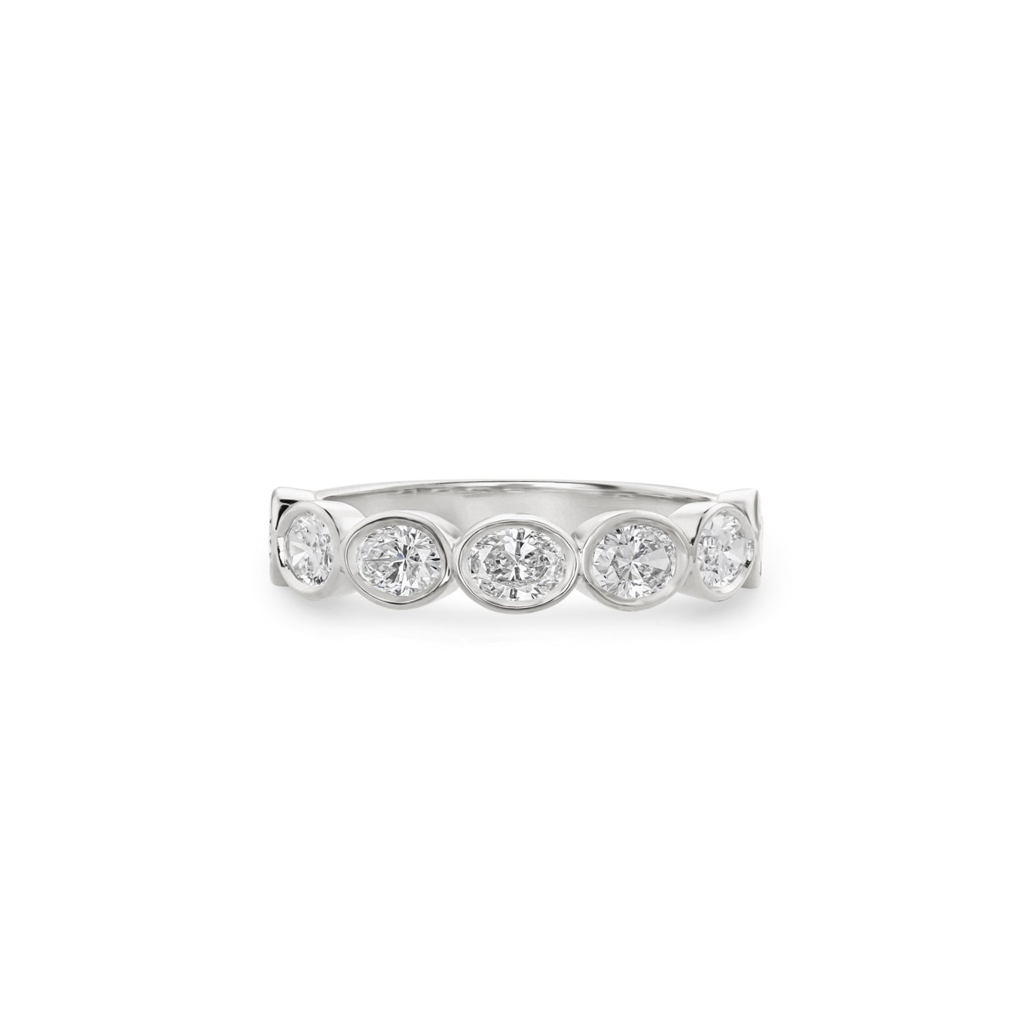 Oval-shaped lab-grown diamonds in white gold bezel settings across a half-eternity ring.