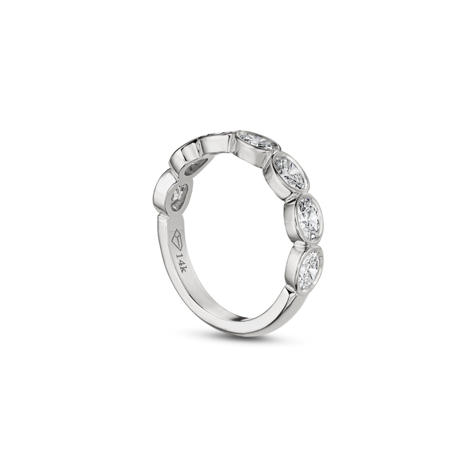 Side profile of an oval-shaped lab-grown diamond bezel half-eternity ring in white gold, showing the settings and polished band.