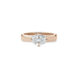Oval-shaped lab-grown diamond set east-west in a rose gold engagement ring with a wide polished band.