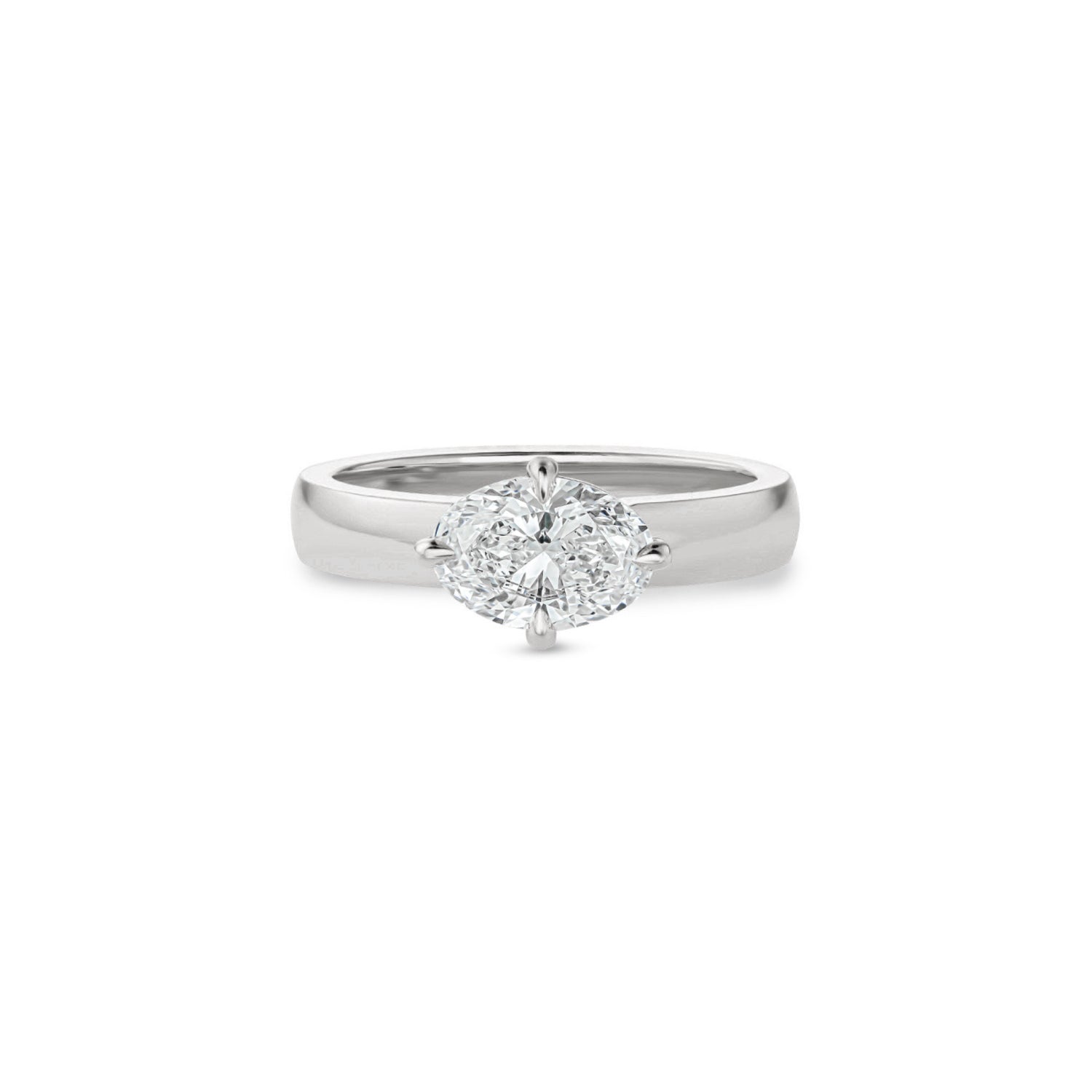 Oval-shaped lab-grown diamond set east-west in a white gold engagement ring with a wide polished band.