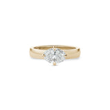 Oval-shaped lab-grown diamond set east-west in a yellow gold engagement ring with a wide polished band.