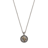 Trchnakir initial medallion necklace with raised yellow gold lettering, a textured silver background and rope-style edging.