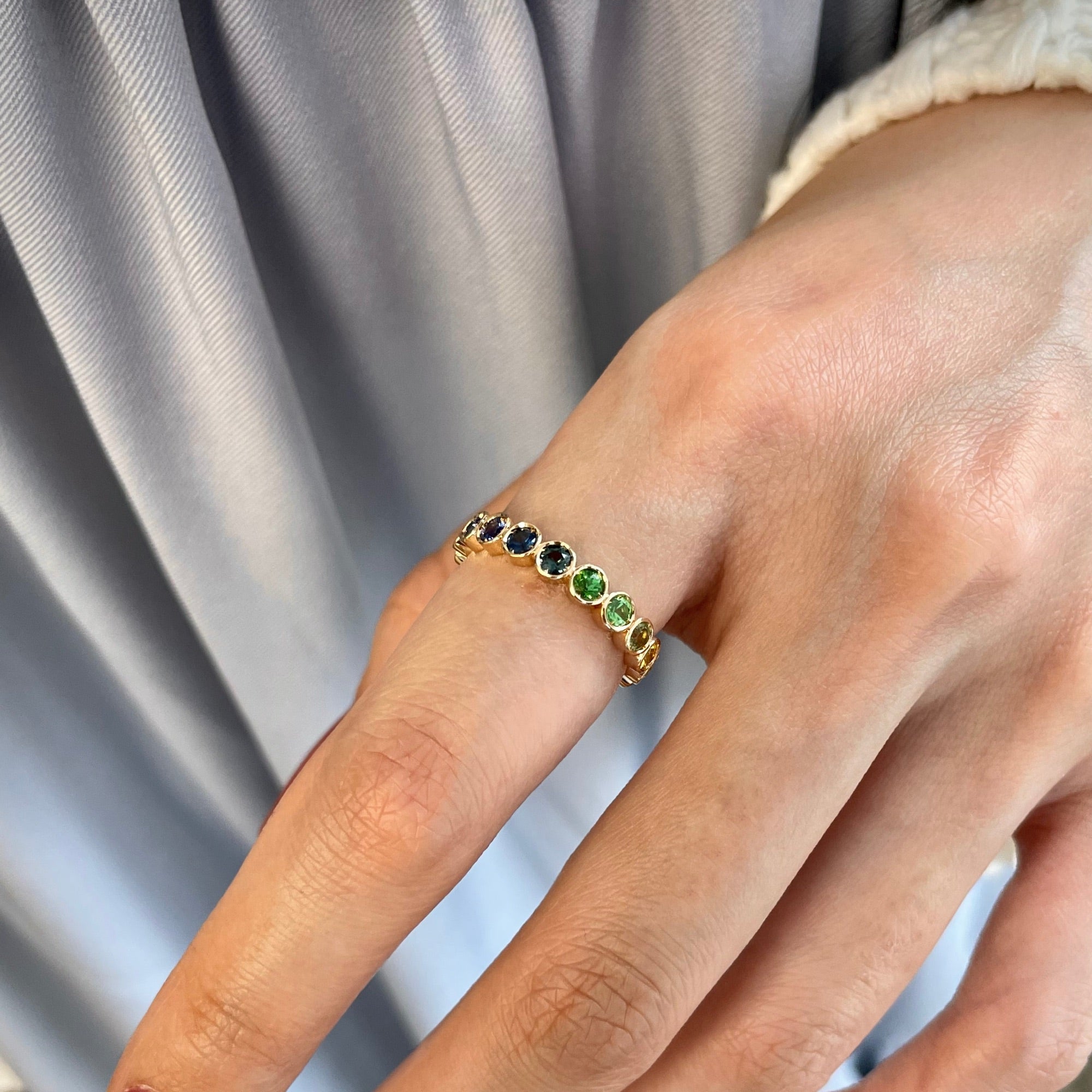 Mermaid Multicolour Sapphire Eternity Ring on a Hand
